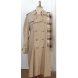 A gentleman's 1970's Burberry double-breasted trench coat, beige cotton/polyester exterior with a