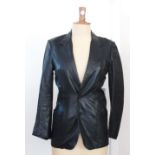 A ladies 1960's Gucci black leather jacket, with three pockets and a black silk lining with the