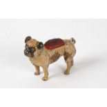 An antique German or Austrian cold painted bronze, taking the form of a pug dog, the base with the
