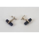 A pair of lapis lazuli and silver cufflinks, of cylindrical form