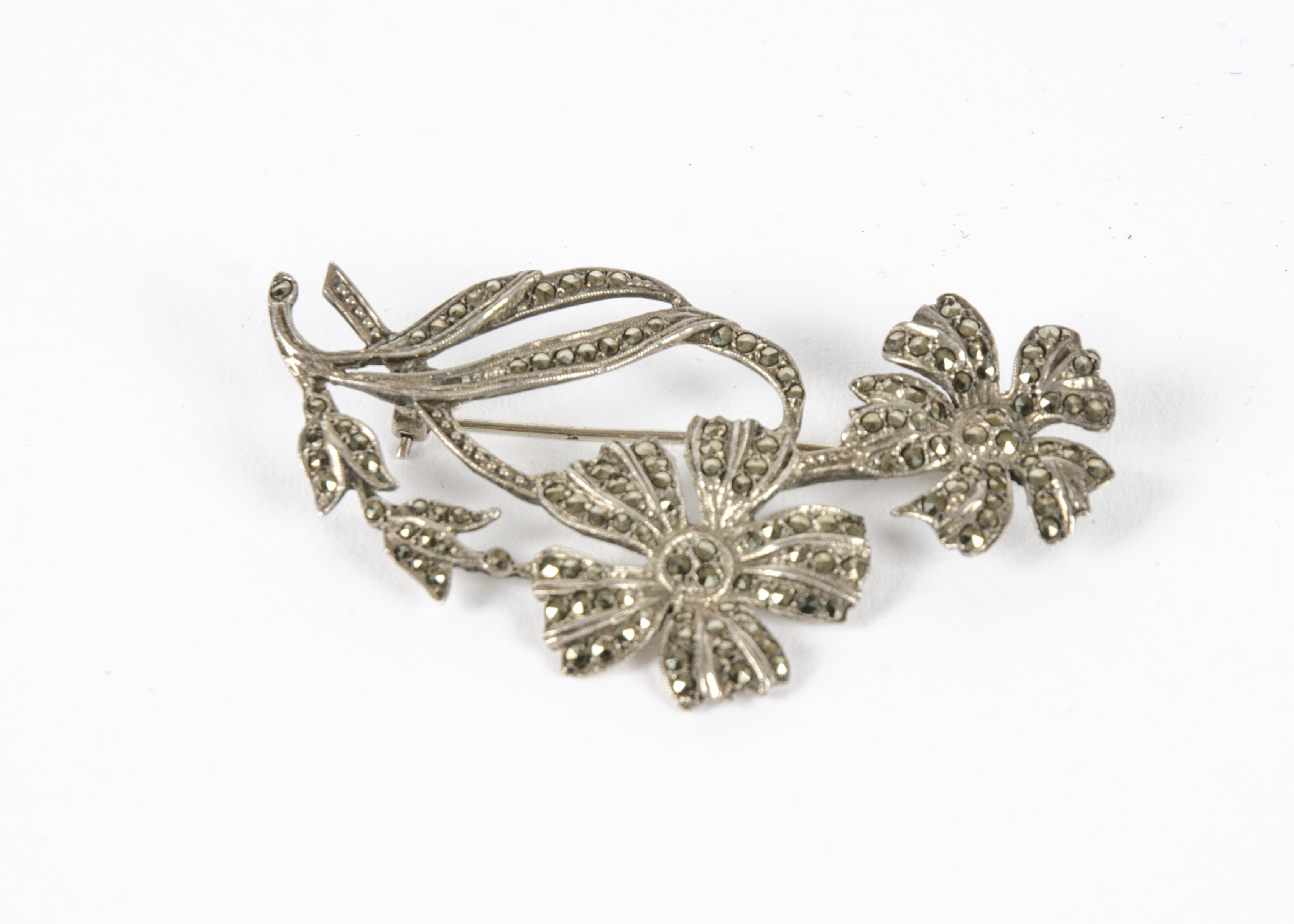 A silver and marcasite brooch, designed as a floral spray, length 6.5cm