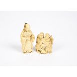 Two Meiji period Japanese ivory okimonos, carved as a figure holding a fan, height 6 cm and a pair