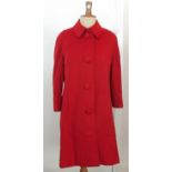 A 1940's Boutique Worth Paris long red woollen coat, four buttons to the front and a black lining,