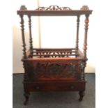 A 19th Century walnut Canterbury whatnot, pierced and scroll fleur-de-lis design to the Canterbury