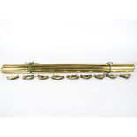 A set of thirteen brass stair rods, length 78cm, together with a quantity of clamps