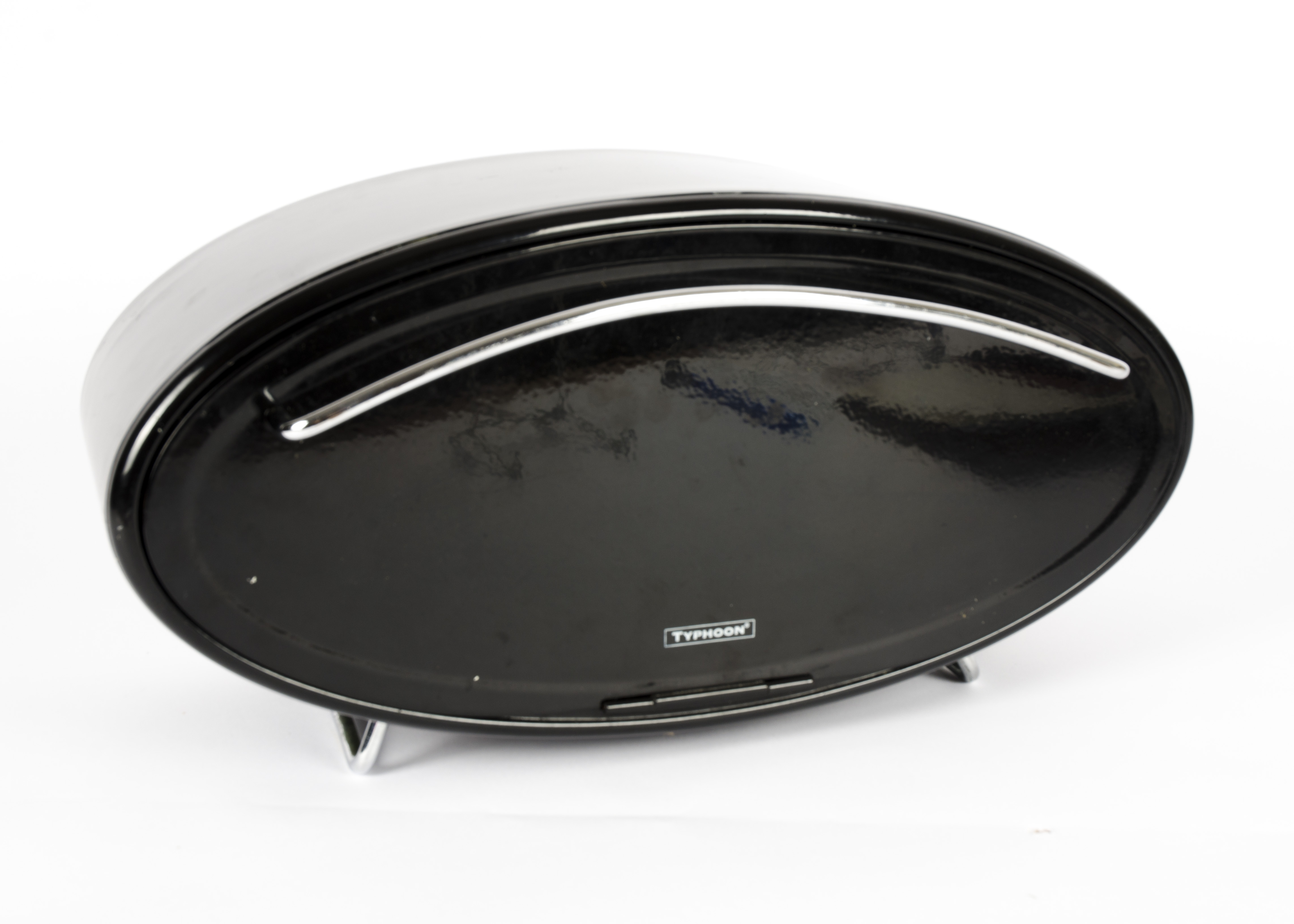 A retro 'Typhoon' oval black enamel bread bin, with a chromed handle pull down front, standing on