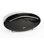 A retro 'Typhoon' oval black enamel bread bin, with a chromed handle pull down front, standing on