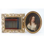 An oval oil on board portrait of a young girl, together with a gilt framed mirror and a black and