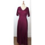 Two items of ladies vintage clothing, including a long dark red purple dress and a white cotton gown