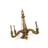 A 20th Century gilt walnut carved electrolier, with six scroll arms and candle bulb sockets,
