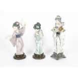 Three Lladro Geisha girls porcelain figurines, including no.5773 'Graceful Offering', height 31cm,