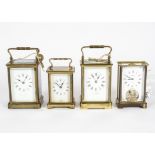 Four mid to late 20th Century carriage clocks, retailed by 'Mappin & Webb' white enamel dial with