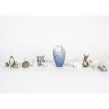 A collection of Royal Copenhagen ceramics, including dogs, rabbits, mice, a pig and more, together