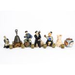 A collection of Douton figures, featuring jovial figures enjoying drinks, together with a novelty