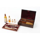 A 19th Century rosewood cased Gentlemen's dressing table box, opening to reveal multiple ivory