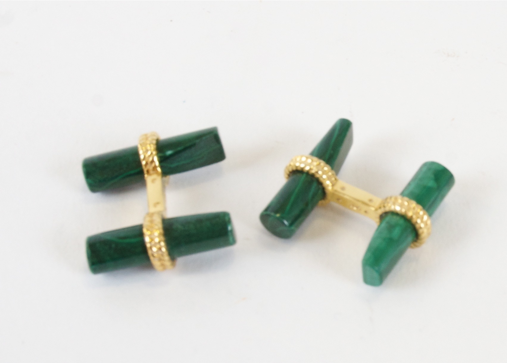 A pair of malachite cufflinks, with gilt rope twist mounts