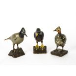 A set of three painted wooden bird figures, depicting a partridge, pigeon and a blackbird (3)