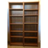 A pair of teak veneered floor standing bookcases, with five adjustable shelves, width 62cm x 32cm