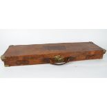 A 19th Century leather rectangular gun case, hinged cover embossed 'R.S.D.F.', red interior