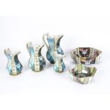 A set of four graduated Carltons Fantasia Burlsam pitchers, decorated with images of fairies on each