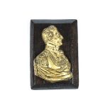 A 19th Century ormolu and cast brass profile bust of Lord Wellington, dressed in uniform, mounted on