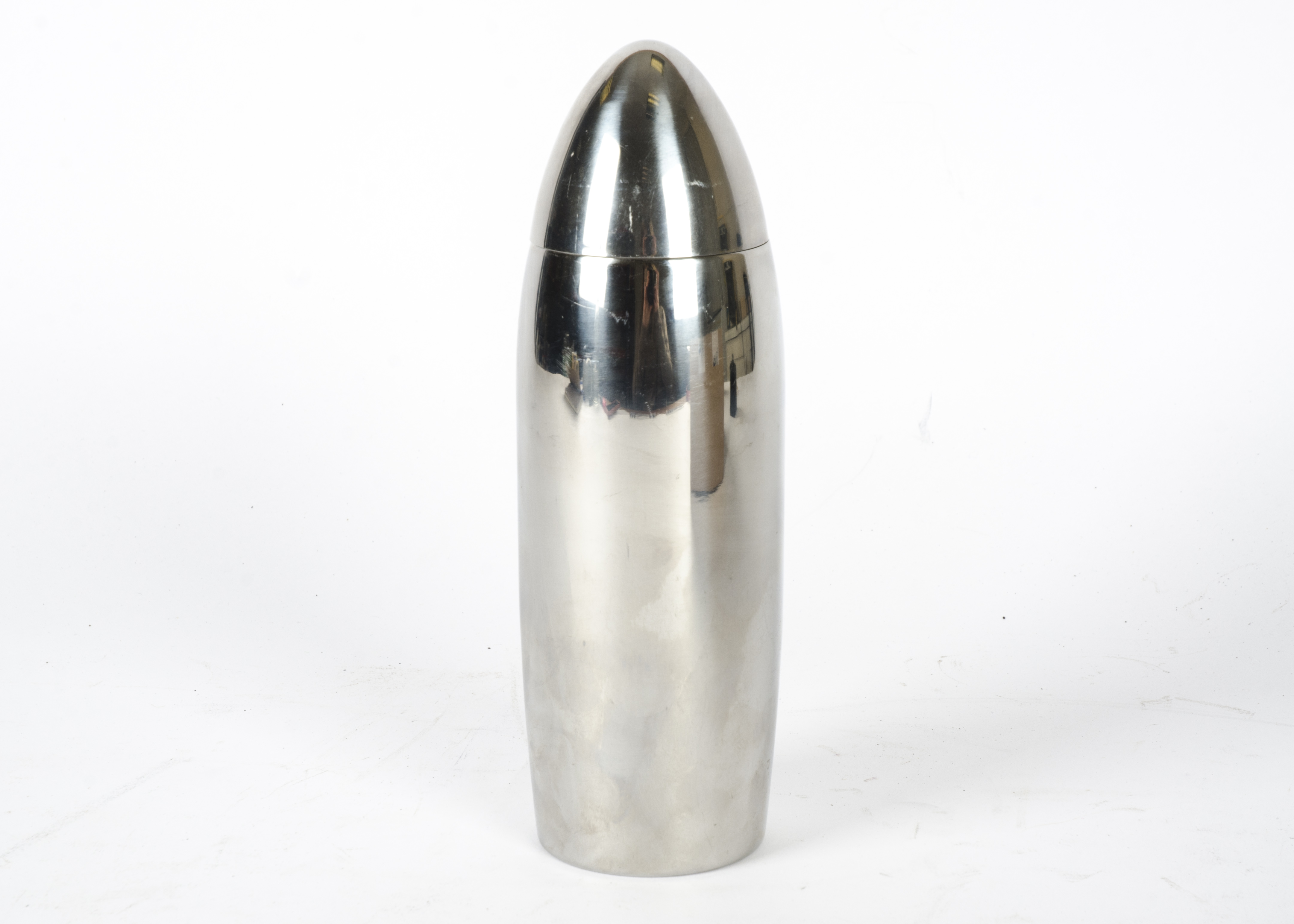 A chrome cocktail shaker, in the shape of a bullet, height 22.5cm