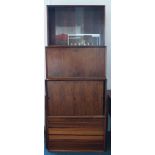 A 1960's Danish six bay wall unit, comprising of five shelves and a cupboard by Poul Cadovius made