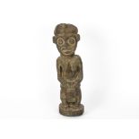 An African tribal figure in a skirt, height 50cm