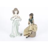 Two Lladro figures, no.6346 'Petals of Love', height 25cm and no.12169 'Repose', height 20cm, in