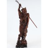 A large Japanese figure, formed from carved boxwood, a Tanuki Samurai with Oni demon around waist,
