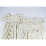 A selection of late 19th/early 20th Century christening gowns, silk, linen and lace examples with