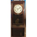 A Gledhill-Brook time recorders ltd patent clock, in a wooden case, with enamel dial behind glass,