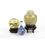 Two Chinese Qing dynasty ginger jars, with polychrome decoration of flowers and dragons upon a