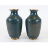 A pair of Asian cloisonné enamel vases, with uniform turquoise colouring, the intricate metalwork