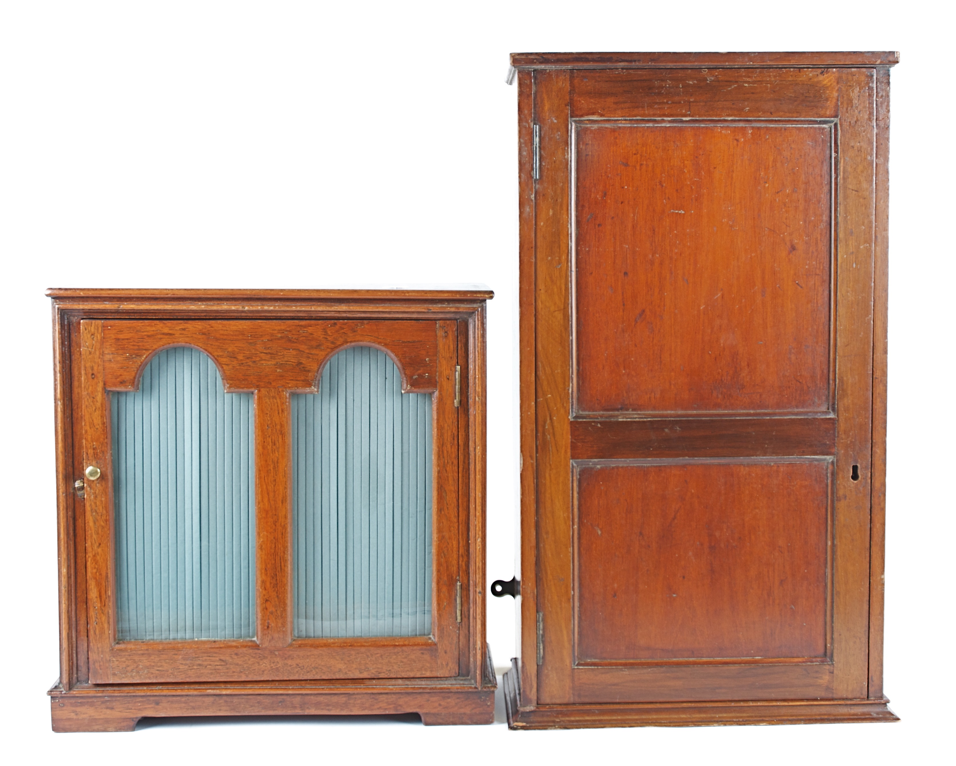 A 20th Century walnut table cabinet, on raised feet with a hinged door with two glass panels, 42cm x