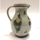 An Edgar Campden Aldermaston pottery jug, tin glaze with brown and blue brushwork, height 18cm