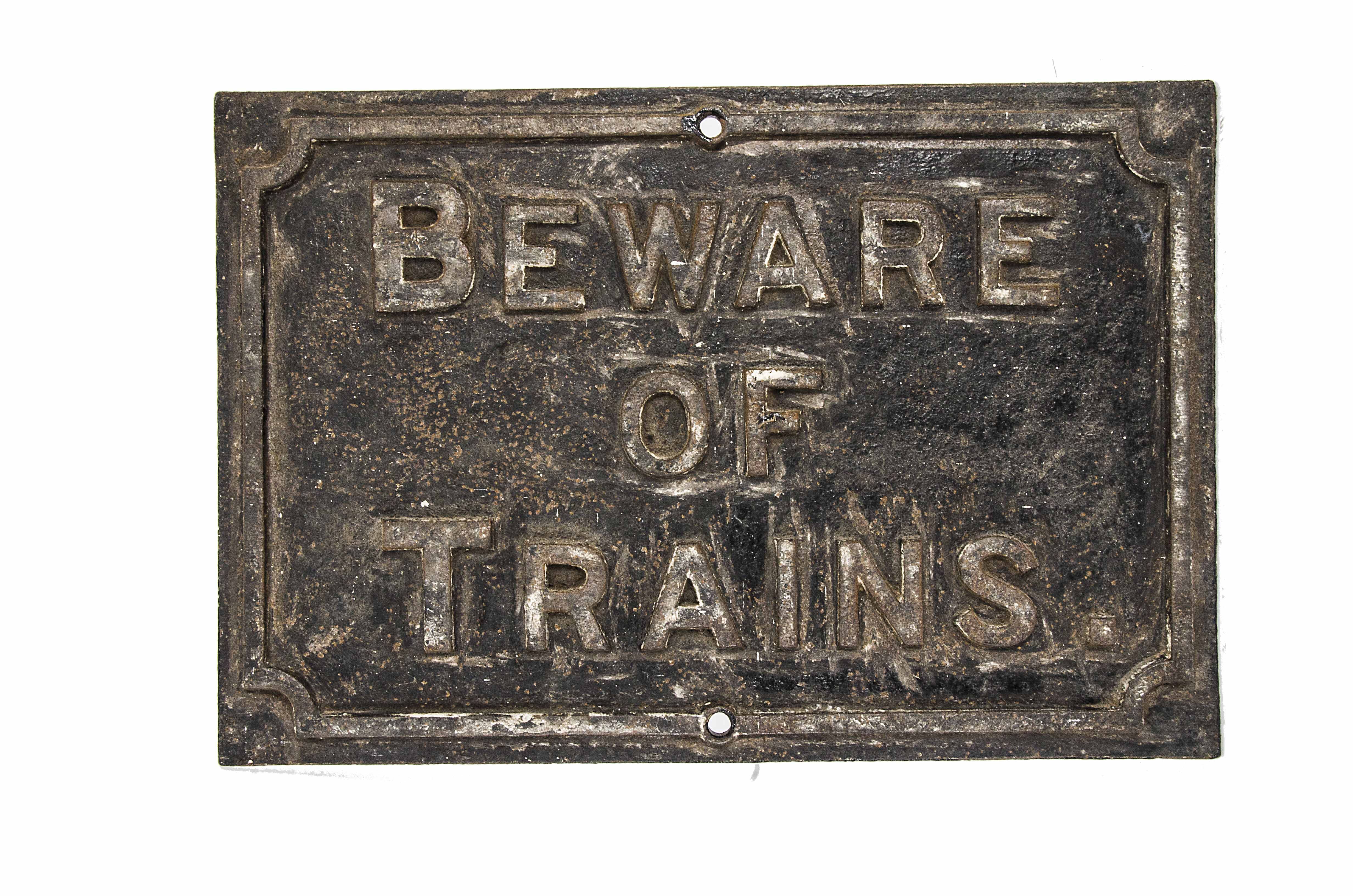 A cast iron 'Beware of Trains' Sign, paint work worn, 23" wide, 15" high, F-G