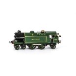 A Scratchbuilt O Gauge Clockwork 4-4-2 Tank Locomotive, a home-made tinplate body finished in SR