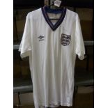 c1988 England, a period replica shirt, signed above the badge by Bobby Robson, number 7 on reverse