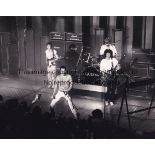 QUEEN / MUSIC BAND Press photograph of Queen in concert in 1984 by David Redfearn with his label