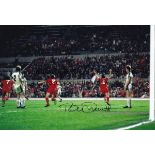 LIVERPOOL Autographed colour 12 x 8 photo, showing Liverpool's Tommy Smith running away in