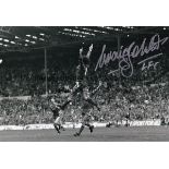 LIVERPOOL Autographed b/w 12 x 8 photo, showing Liverpool's Craig Johnston jumping with joy after