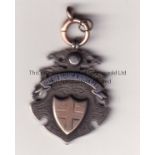 FOOTBALL MEDAL 1913/14 A hallmarked silver medal with a gold shield in the centre, issued by City of