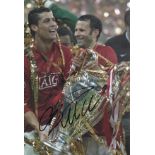 CRISTIANO RONALDO AUTOGRAPH A 12" x 8" colour photograph of Christiano Ronaldo holding the Champions