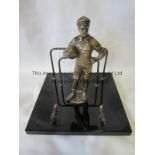 FOOTBALL STATUETTE An Austrian desk set circa 1920's including 6" metal goalkeeper on an onyx