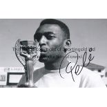 PELE CARLOS ALBERTO AUTOGRAPHS A 12" x 8" black & white photograph of Pele kissing the World Cup.