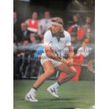 BJORN BORG A signed colour poster (15ins x 12ins) of Bjorn Borg in action. Generally good