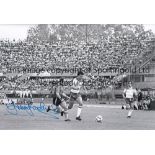 TREVOR BROOKING B/W 12 x 8 photo, showing Trevor Brooking in full length action with the ball at his