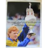 LEEDS Col 16 x 12 photo, showing Leeds United captain Gordon Strachan holding aloft the First