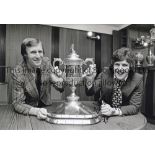 CELTIC B/W 12 x 8 photo, showing Celtic's new signing Ronnie Glavin posing with the Scottish Cup and